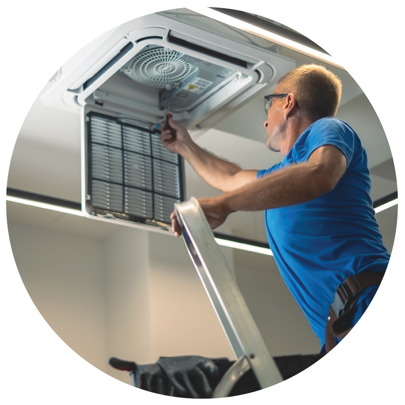 A facility manager fixing ceiling vent