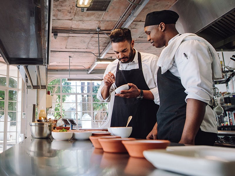 chefs discussing menu options in a foodservice establishment-foodservice solutions