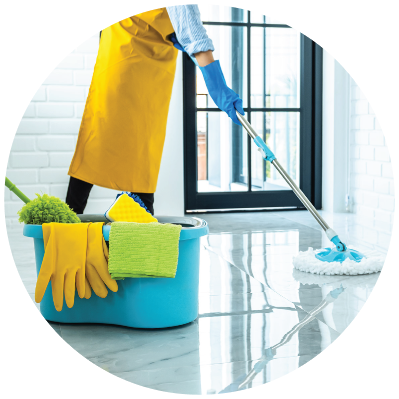 A janitor mopping the floor with cleaning bucket on the floor with supplies