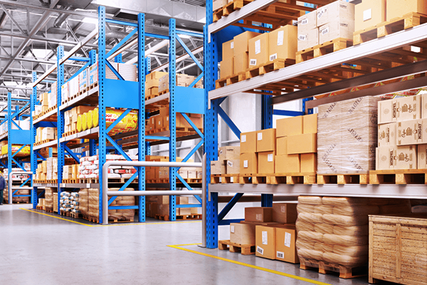 A warehouse full of shelves and shipping boxes stored