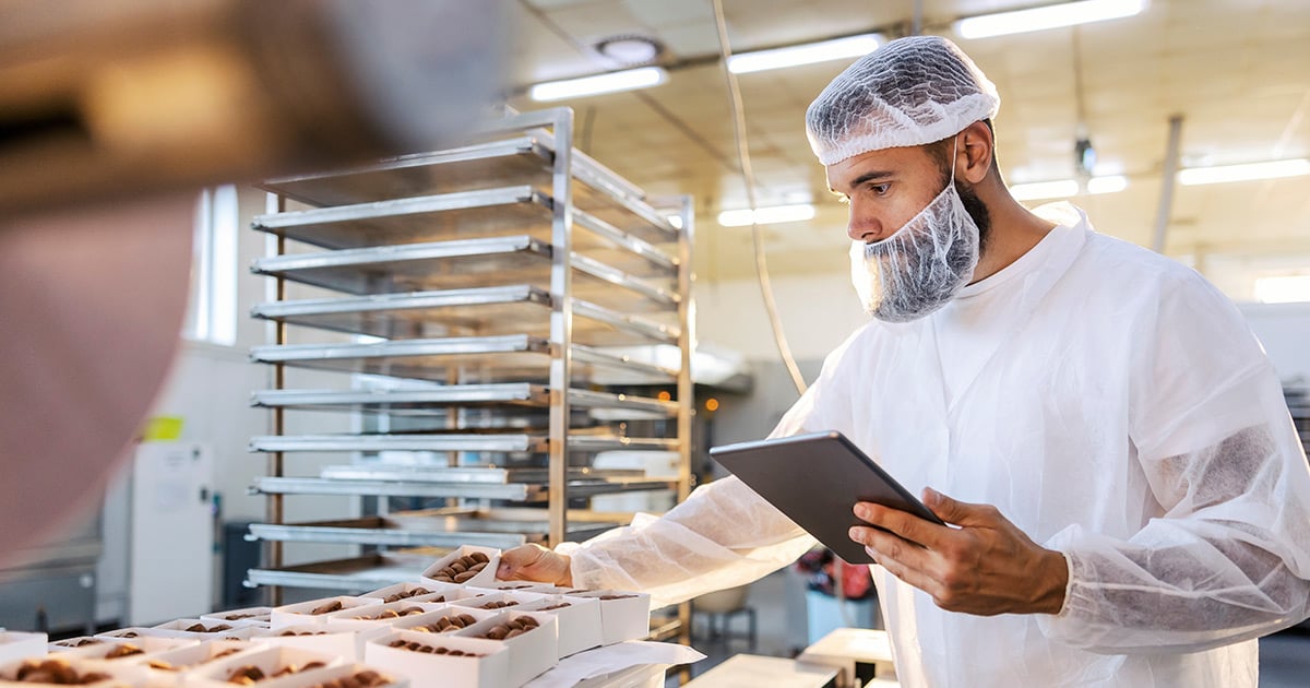 a restaurant staff wearing PPE - hairnet and beard cover