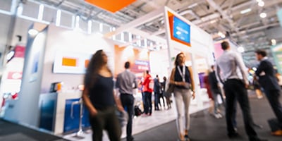 A blurred image of tradeshow floor