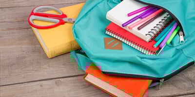 an image showing a backpack with school supplies