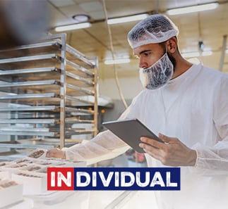 foodservice professional wearing hairnet and beard cover as PPE