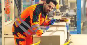 a technician assessing automated packaging line in the warehouse