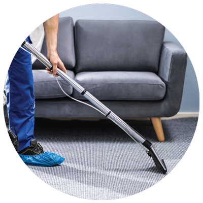 a janitor vacuuming carpet floor in the office