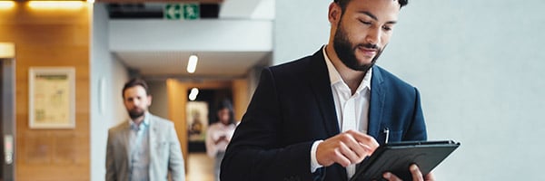 hospitality manager looking at numbers on spend report