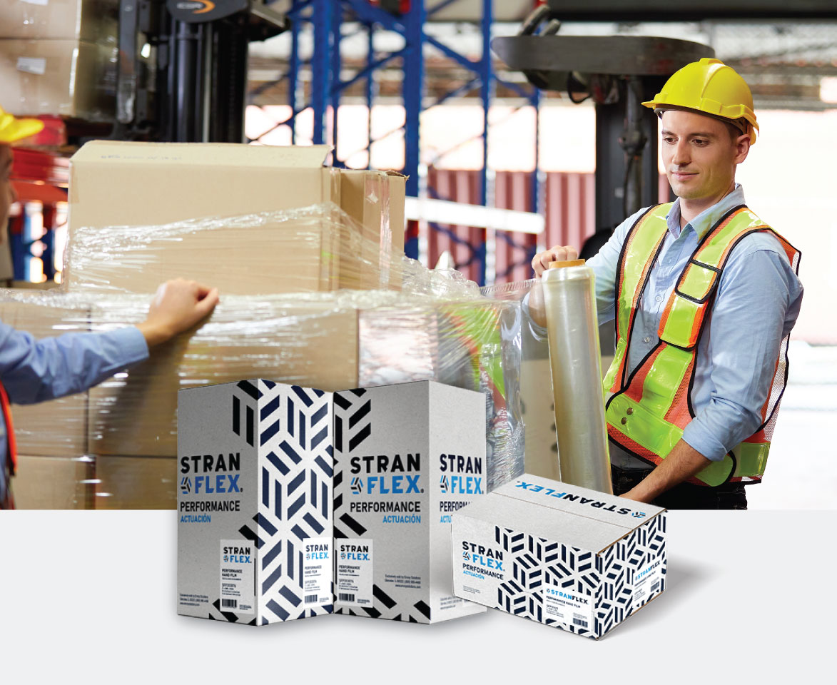 warehouse staff working on strapping pallet
