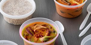 disposable bowl containg soap with disposable cutlery