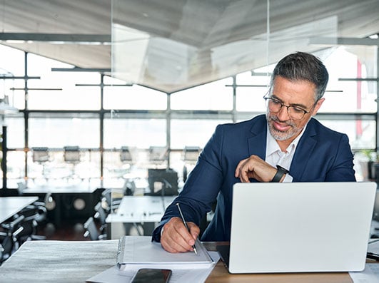 businessman in suit working at a desk