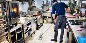 restaurant staff cleaning the floor - cleaning supplies