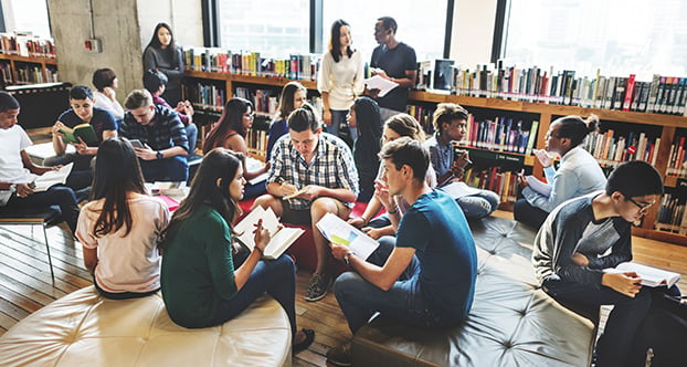 college library with students and faculty