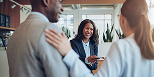 Guest checking in with great service by hotel front desk staff