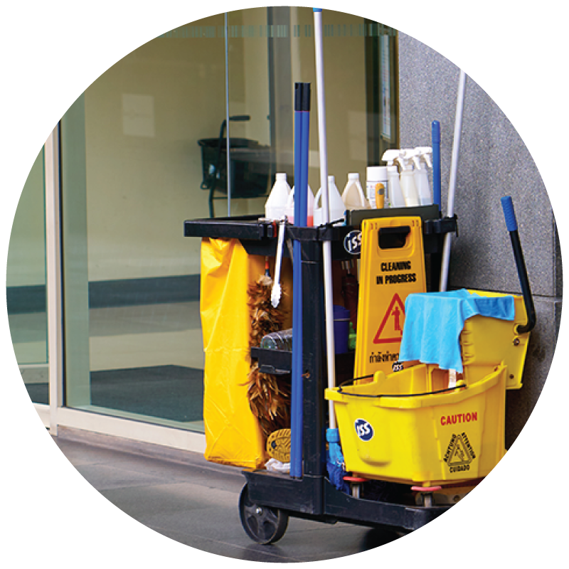 A janitor's cart standing outside of a building door