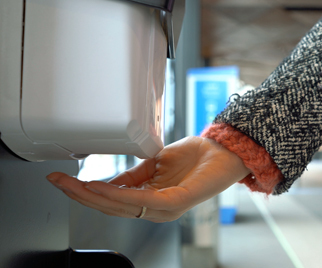 a person using hand sanitizer