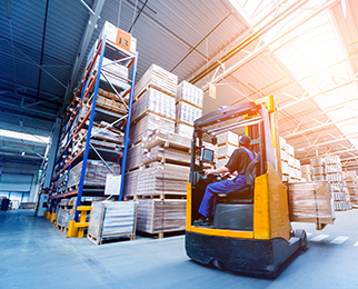 a warehouse worker operating forklift to move shipments