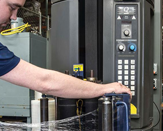 planned maintenance for packaging equipment - a technician assessing the stretch wrapper